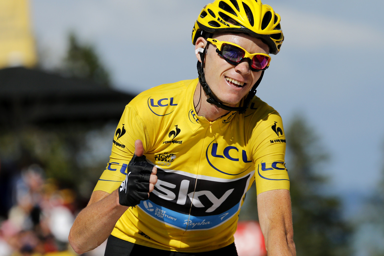 Stage's third placed overall leader's yellow jersey Britain's Christopher Froome thumbs up as he crosses the finish line at the end of the 125 km twentieth stage of the 100th edition of the Tour de France cycling race on July 20, 2013 between Annecy and Annecy-Semnoz, French Alps. AFP PHOTO / JEFF PACHOUD (Photo credit should read JEFF PACHOUD/AFP/Getty Images)